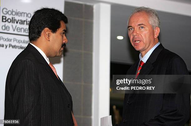 The president of the state-run Venezuelan Petroleum oil company , Rafael Ramirez , talks with Venezuelan Minister of Foreign Relations, Nicolas...