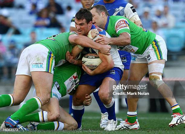 Chris Armit of the Bulldogs is tackled during the round 22 NRL match between the Bulldogs and the Canberra Raiders at Telstra Stadium August 12, 2007...