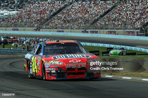 Jeff Gordon, driver of the DuPont Chevrolet, leads Jeremy Mayfield, driver of the 360 OTC Toyota, during the NASCAR Nextel Cup Series Centurion Boats...