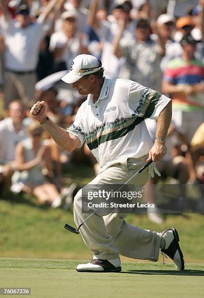 Woody Austin celebrates his birdie putt on the 12th green during the final round of the 89th PGA Championship at the Southern Hills Country Club on...