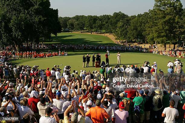 Tiger Woods celebrates with the Wanamaker Trophy after his two-stroke victory at the 89th PGA Championship at the Southern Hills Country Club on...