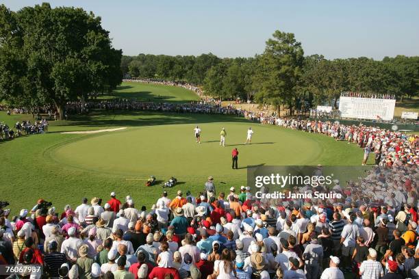 Tiger Woods hits a putt on the 18th green during the final round of the 89th PGA Championship at the Southern Hills Country Club on August 12, 2007...