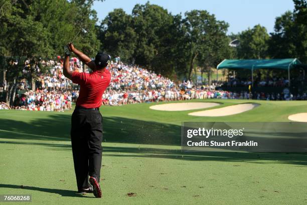 Tiger Woods hits his approach shot on the 17th hole during the final round of the 89th PGA Championship at the Southern Hills Country Club on August...