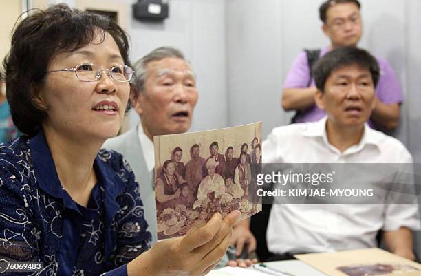 Park Se-Yun's South Korean family members talk to Park's North Korean younger sister Park Se-Hwa's family during the sixth round of the video family...