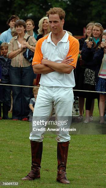 Prince William waits to receive his cup after winning the polo match between Apes Hill Club Barbados against Churchill Retirement Living for the...