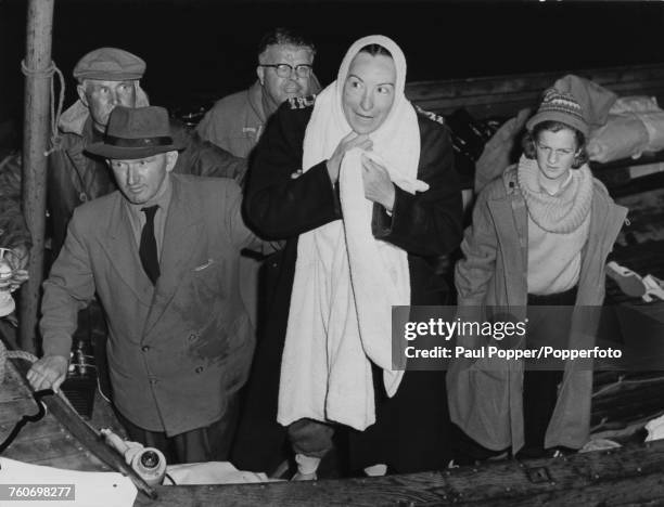 American long-distance swimmer Florence Chadwick after her night time crossing of the Bristol Channel, 5th August 1957. Chadwick swam the 11 miles...