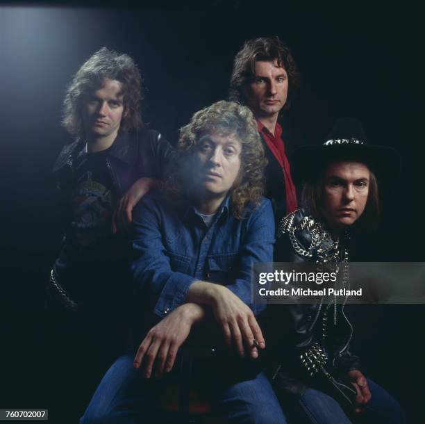 Studio portrait of English rock group Slade, posed in London circa 1975. Clockwise, from front: singer Noddy Holder, bassist Jim Lea, drummer Don...