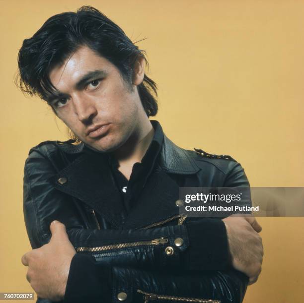 English singer, songwriter, musician, and producer, Chris Spedding posed wearing a leather biker jacket in October 1975.