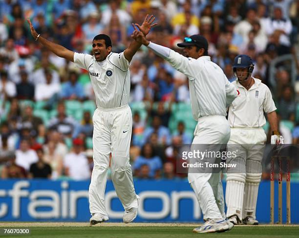 Zaheer Khan of India appeals for the wicket of Andrew Strauss of England with captain Rahul Dravid during day five of the Third Test match between...