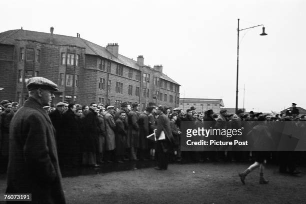 Football fans queuing to get into Ibrox to see Rangers play Celtic in an Old Firm match, 15th October 1949. Original Publication : Picture Post -...