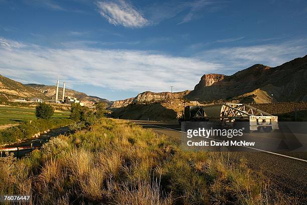Coal truck drives along Highway 31 near the coal-powered Huntington Canyon Power Plant on the first morning of the second week of rescue efforts to...