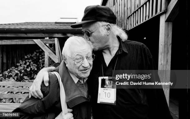 Pulitzer Prize winning Photographer Eddie Adams hugs Life Magazine Photographer Carl Mydans behind the scenes of Barnstorm, August 30, 1997 in...