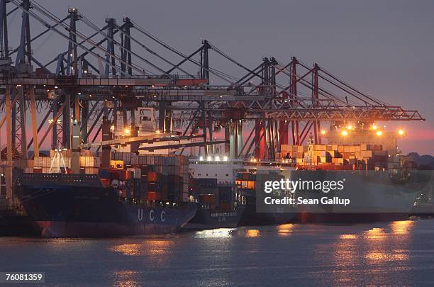 Container ships dock among cranes at the main container port August 13, 2007 in Hamburg, Germany. Northern Germany, with its busy ports of Hamburg,...