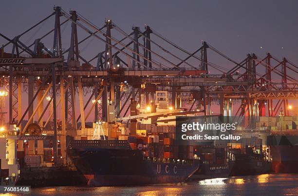 Container ships dock among cranes at the main container port August 13, 2007 in Hamburg, Germany. Northern Germany, with its busy ports of Hamburg,...