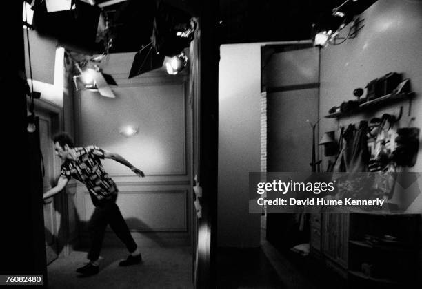 Michael Richards as "Kramer" prepares to burst through the door during the final days of shooting Seinfeld, April 3, 1998 in Los Angeles, California.