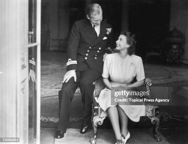 Princess Elizabeth and her fiance, Philip Mountbatten at Buckingham Palace, after their engagement was announced, 10th July 1947.