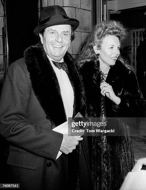 Barry Humphries with his wife arrive for the opening night of the musical "Follies" on July 21, 1987 in London.