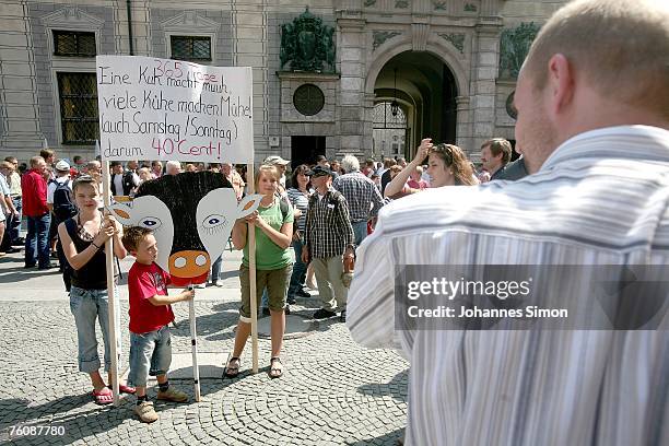 Camera man films protesting farmer children during a demonstration of the German dairy board on August 14, 2007 in Munich, Germany. More than 10.000...