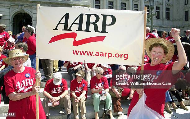 Emily Sconing and Gladys Montgomery rally on the front steps of the State Capitol with more than 1,000 AARP members seeking the expansion of the PACE...