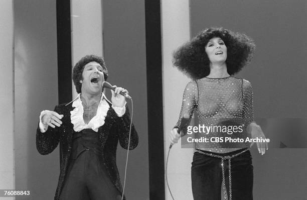 Welsh singer Tom Jones and American singers Cher perform a duet on an episode of 'The Sonny and Cher Show,' October 28, 1976.