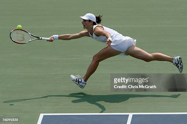 Nathalie Dechy of France returns to Emmanuelle Gagliardi of Switzerland during the Rogers Cup August 14, 2007 at the Rexall Center in Toronto,...