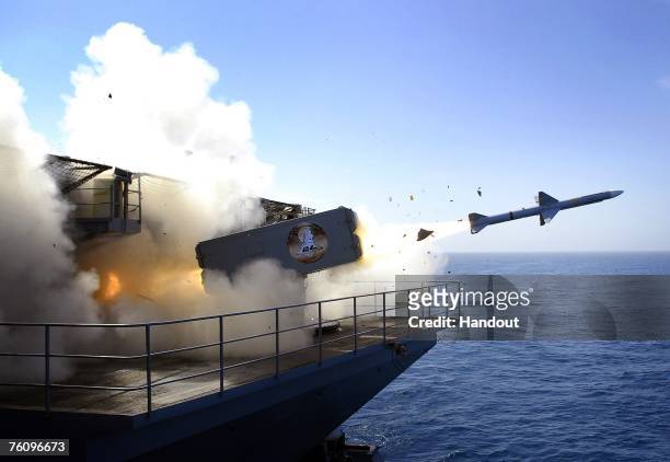 In this handout photo provided by the U.S. Navy, a RIM-7P NATO Sea Sparrow Missile launches the Nimitz-class aircraft carrier USS Abraham Lincoln...