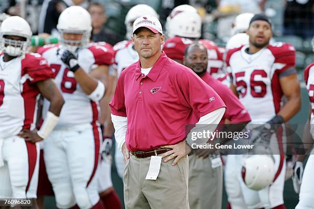 Arizona Cardinals head coach Ken Whisenhunt watches from the sidelines during a preseason game against the Oakland Raiders at McAfee Coliseum in...