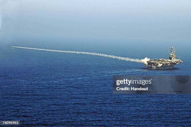 In this handout photo provided by the U.S. Navy, a RIM-7P NATO Sea Sparrow Missile launches from Nimitz-class aircraft carrier USS Abraham Lincoln...