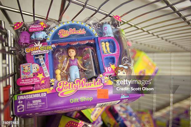 Recalled toys are piled in a shopping cart after being pulled from the shelves at the Cut Rate Toys toy store August 14, 2007 in Chicago, Illinois....
