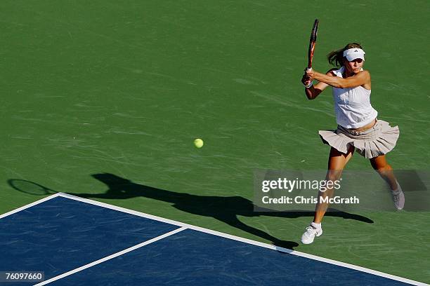 Maria Kirilenko of Russia returns a shot to Martina Muller of Germany during the Rogers Cup August 14, 2007 at the Rexall Center in Toronto, Ontario,...