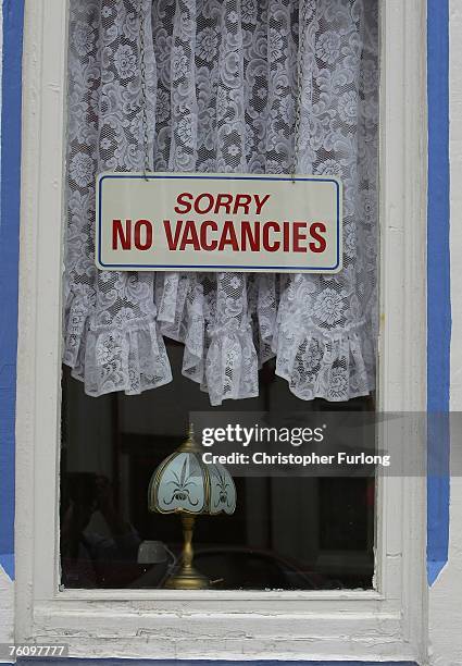 No vacancies sign hangs in the window next to the traditional net curtains of a Bed and Breakfast on August 13, 2007 in Blackpool, England. The...