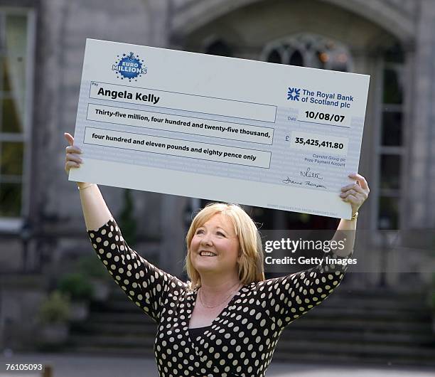 Record Euro Lottery winner Angela Kelly celebrates her win in front of assembled media, August 15, 2007 in Falkirk Scotland. Kelly, who scooped a...