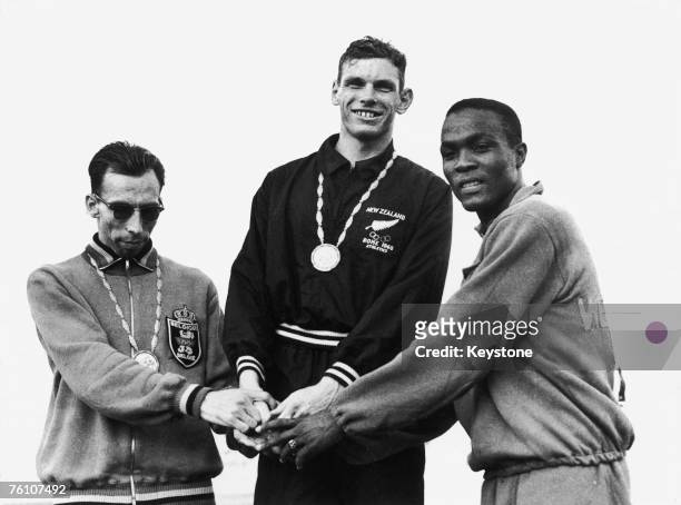 Peter Snell of New Zealand on the winner's podium after winning the 800 Metres event at the Olympic Games in Rome, 3rd September 1960. With him are...