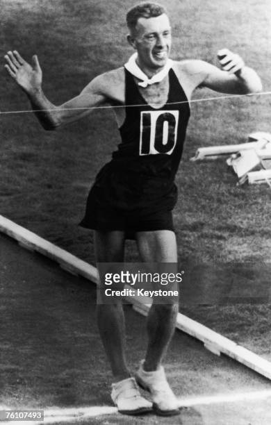 Racewalker Norman Read of New Zealand wins the final of the 50 kilometre walk event at the Olympic Games in Melbourne, Australia, 29th November 1956....
