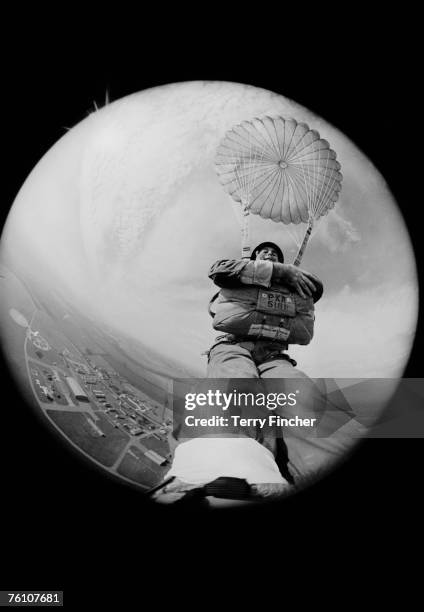 Express photographer Terry Fincher takes a self portrait using a camera strapped to his foot, whilst parachuting from a hot air balloon, 9th March...