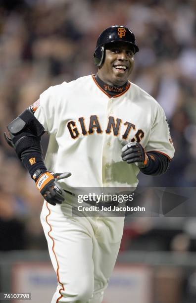 Barry Bonds of the San Francisco Giants celebrates after hitting career home run against Mike Bacsik of the Washington Nationals on August 7, 2007 at...