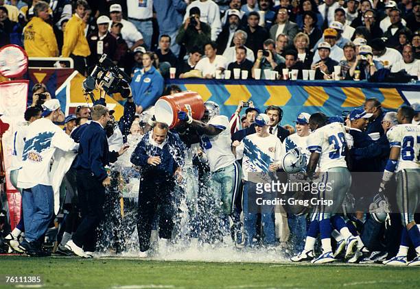 Dallas Cowboys head coach Barry Switzer receives a celebratory cold bath in the final moments of the Dallas Cowboys 27-17 victory over the Pittsburgh...