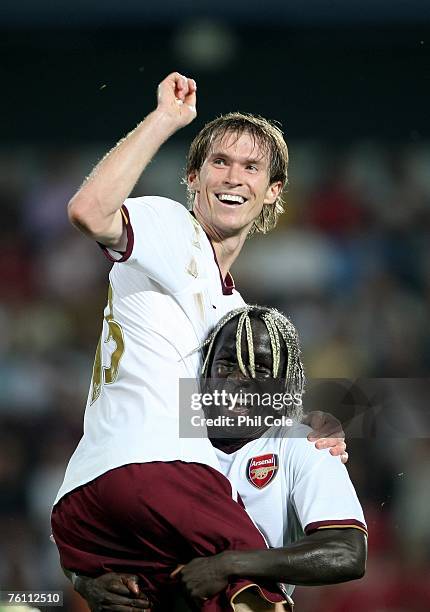 Alex Hleb of Arsenal gets congratulated by Bacary Sagna after scoring during the Champions League 3rd qualifying round 1st leg between Sparta Prague...