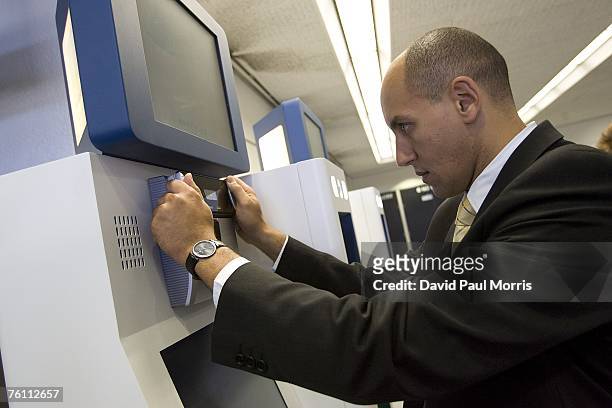 Sam Elgord has his irises scanned as he demonstrates Clear, a new security program, at the San Francisco International Airport on August 15, 2007 in...