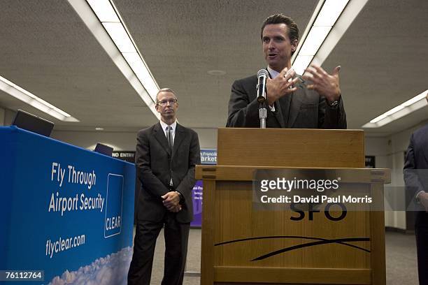 San Francisco Mayor Gavin Newsom and SFO Director John Martin speak during a press conference announcing Clear, a new security program, at the San...