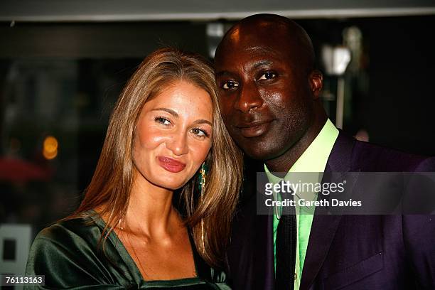 Designer Ozwald Boateng and his wife Gyunel arrive at the UK premiere of "The Bourne Ultimatum" at Odeon Leicester Square on August 15, 2007 in...
