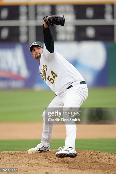 Andrew Brown of the Oakland Athletics pitches during the game against the Los Angeles Angels at the McAfee Coliseum in Oakland, California on August...