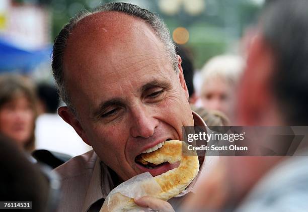 Republican Presidential Candidate and former New York City Mayor Rudy Giuliani tastes a pretzel at the Iowa State Fair August 15, 2007 in Des Moines....