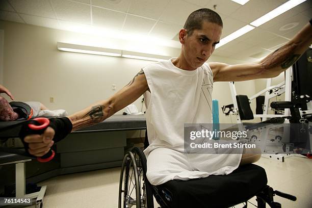 Josh Stein is a double amputee rehabilitation patient at Brook Army Medical Centre. He is pictured excercising in the rehabilitation gym at Brook...