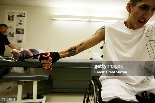 Josh Stein is a double amputee rehabilitation patient at Brook Army Medical Centre. He is pictured excercising in the rehabilitation gym at Brook...