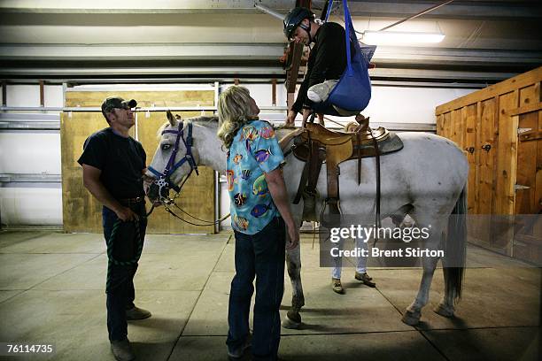 Specialist Andrew W. Soule learns to ride a horse, part of a series of choices he made as to which sports he wanted to pursue as part of a week of...