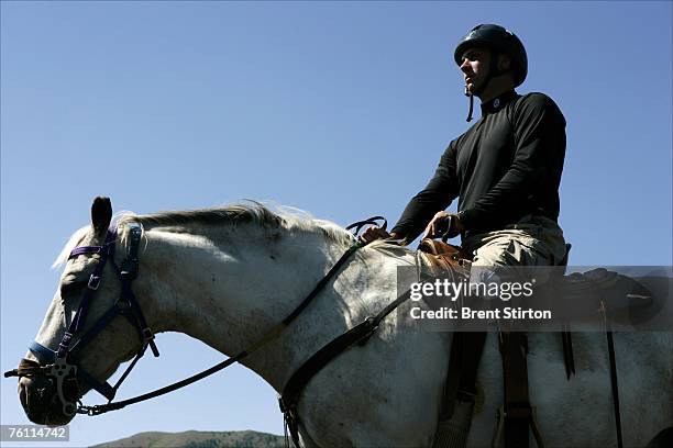 Specialist Andrew W. Soule learns to ride a horse, part of a series of choices he made as to which sports he wanted to pursue as part of a week of...