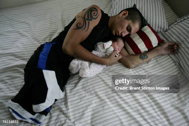 Josh Stein is pictured at home with his two daughters, new-born Jasmine and 2 year old Rachel on August 23, 2006 in San Antonio, Texas. Stein is a...