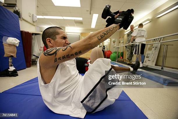 Josh Stein is a double amputee rehabilitation patient at Brook Army Medical Centre. He is pictured excercising in the rehabilitation gym at Brook...