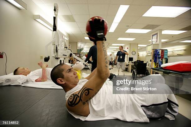 Josh Stein is a double amputee rehabilitation patient at Brook Army Medical Centre. He is pictured excercising in the rehabilitation gym at Brook...